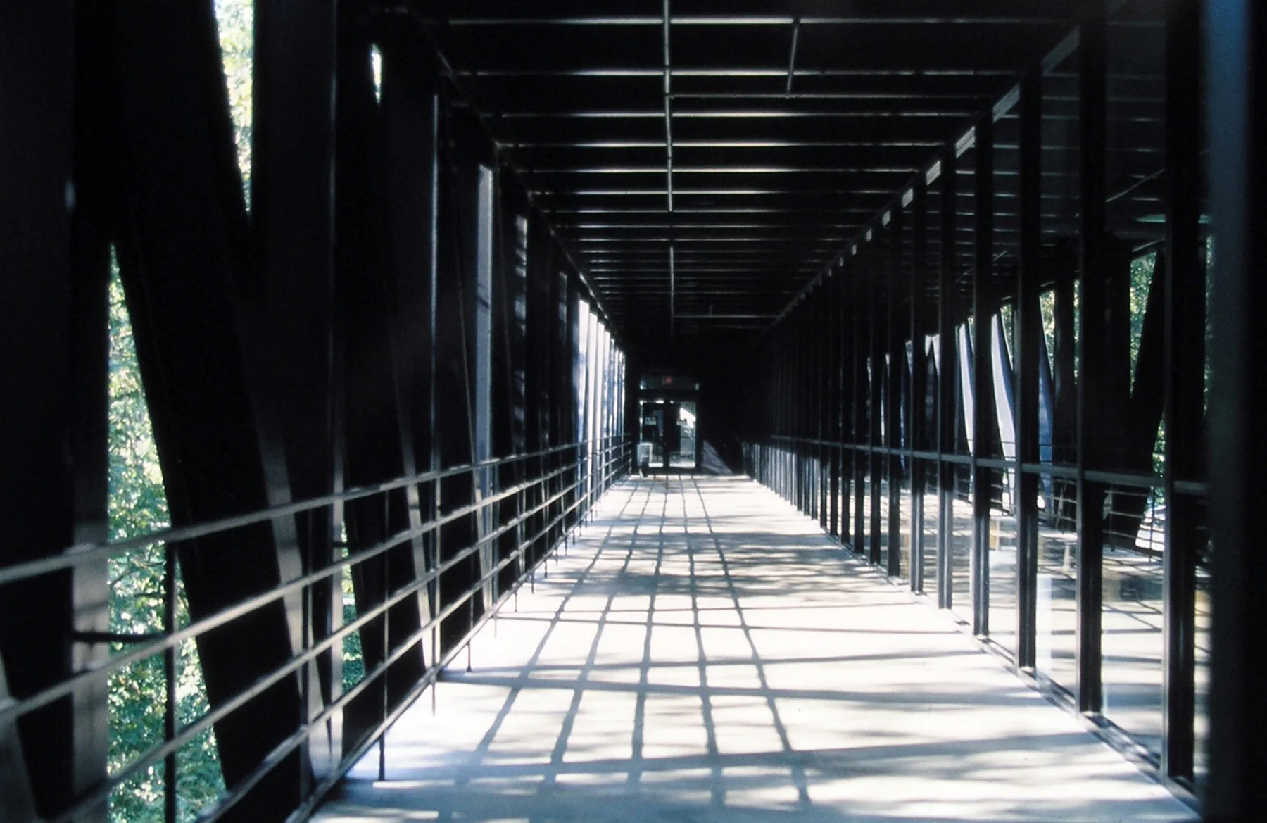 Craig Ellwood's Art Center College of Design in Pasadena: a long black steel-and-glass bar spanning a wooded ravine.