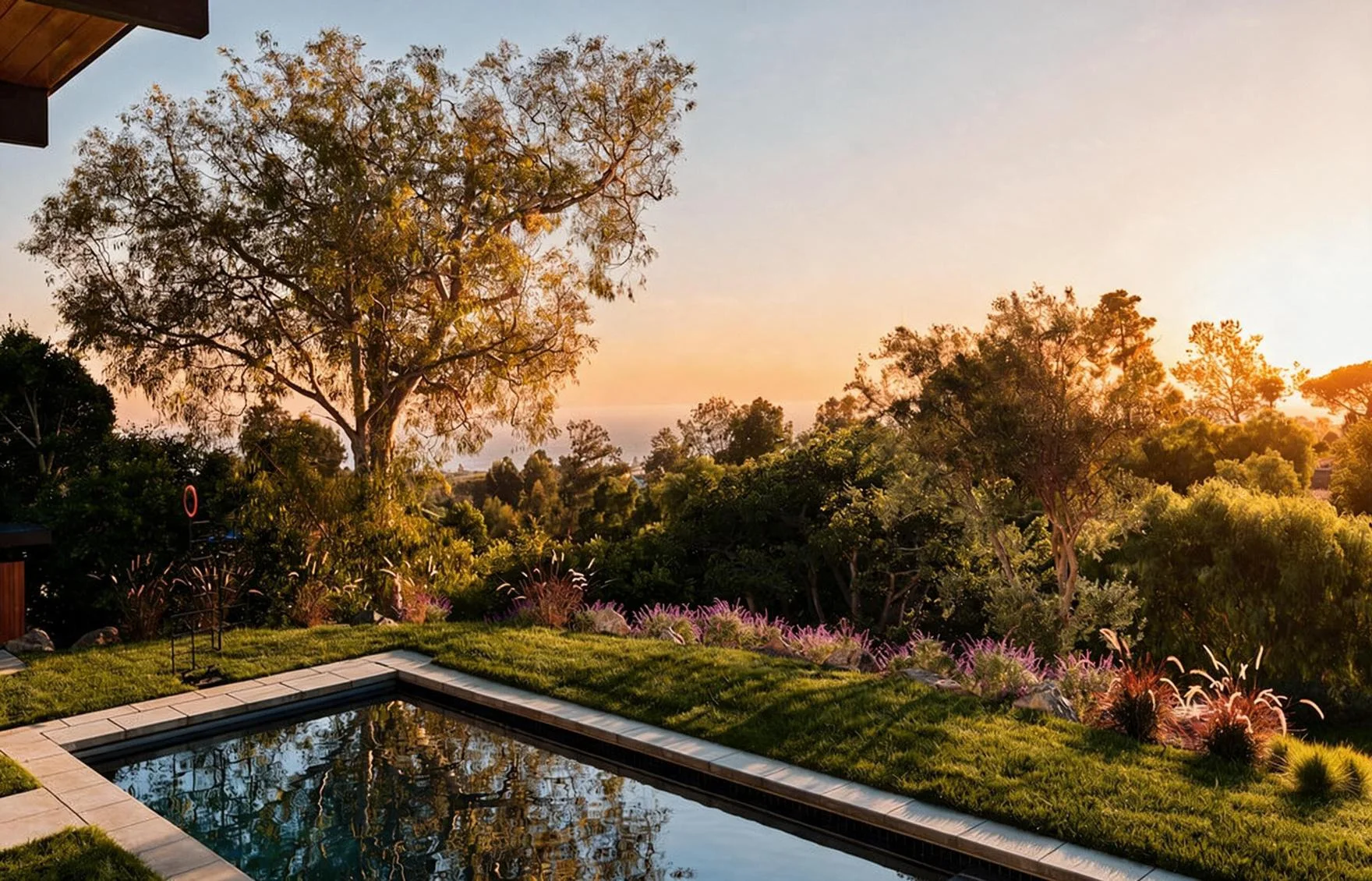The lap pool at the lawn's edge, the old oak beyond.
