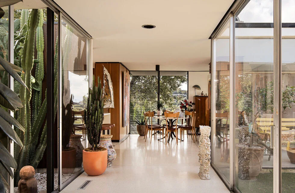 The living and dining room along the glass.