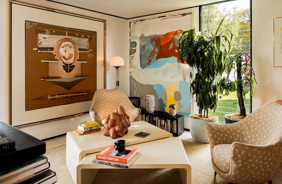 The lounge, its walls hung with art.
