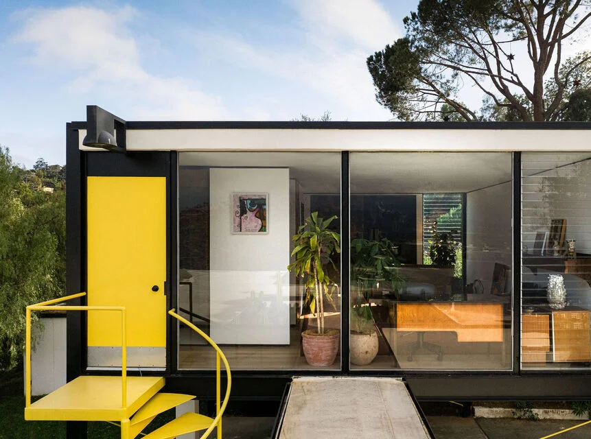 The guest house over the carport, reached by the yellow stair.