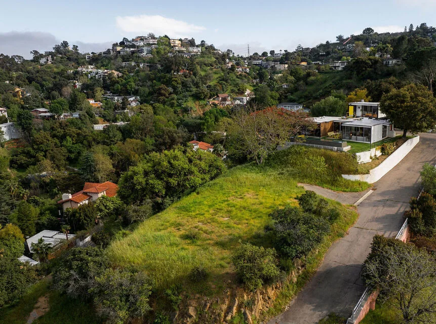 The house from the air, in its canyon.