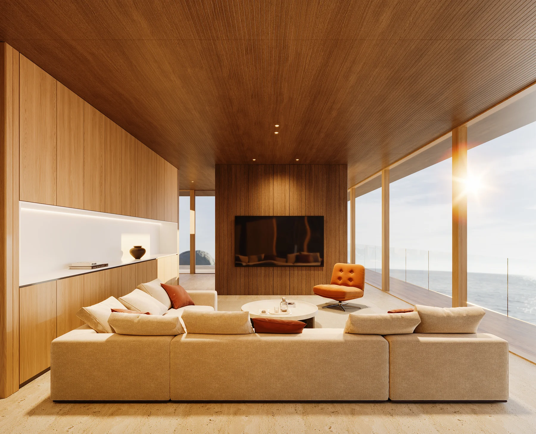The living room's television wall at dusk, orange lounge chairs before it.