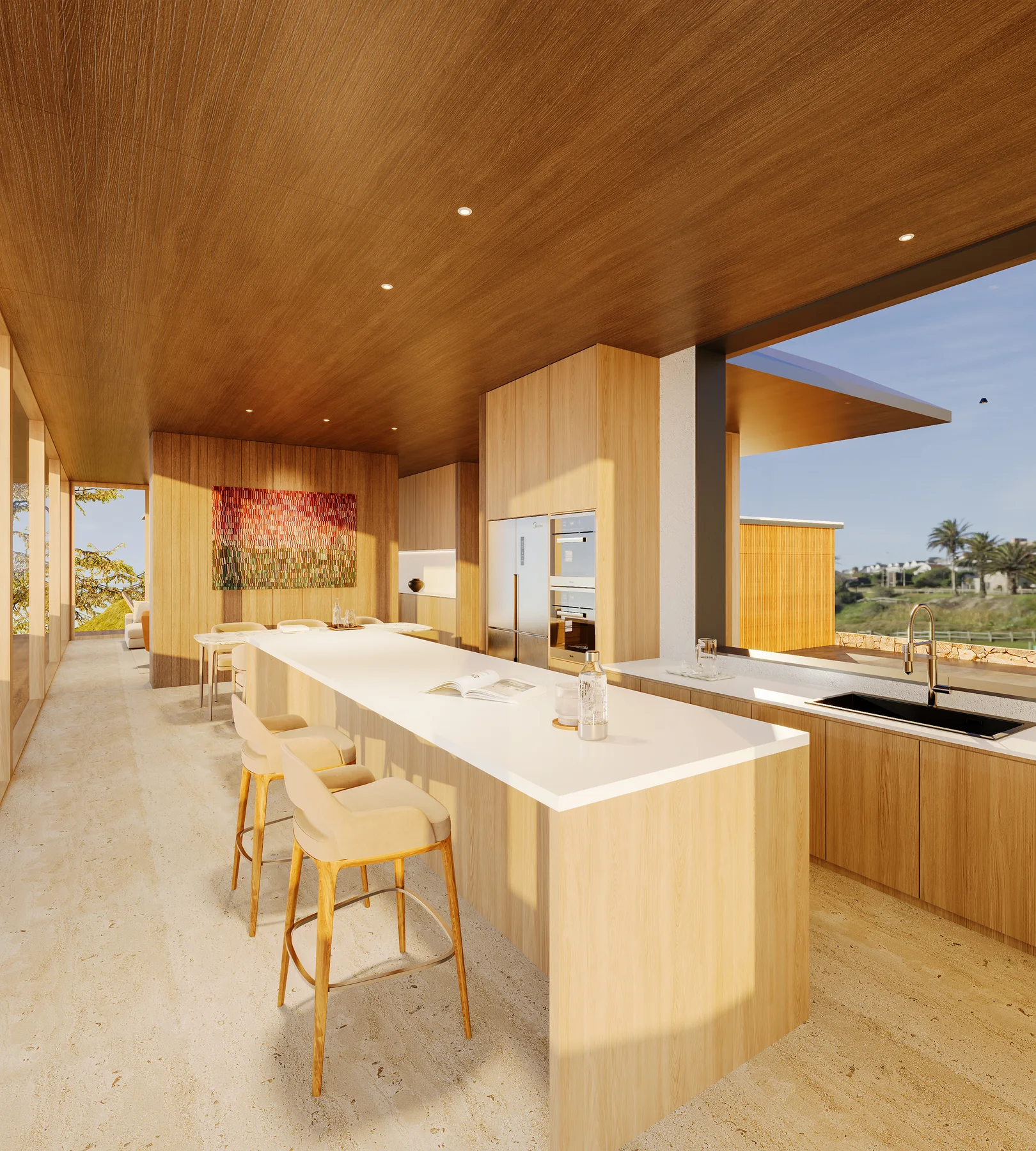 The kitchen island by day, the cabinetry and sink beyond.