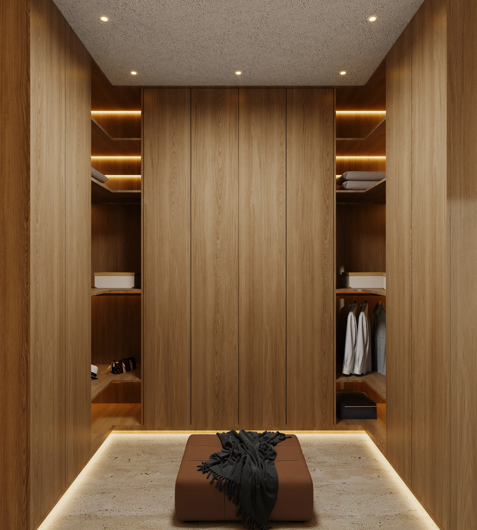 The walk-in closet, lit shelving either side.