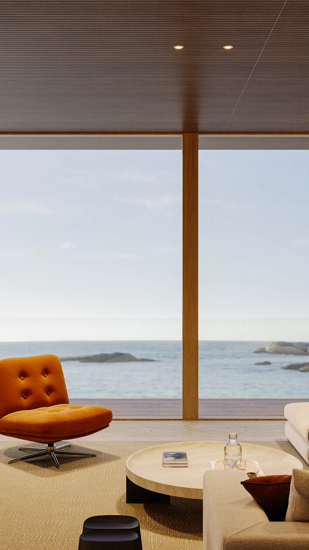 A lounge by day, orange chairs before the water.