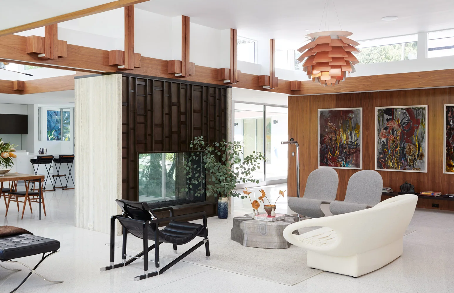 The living room from the garden side, art on the walls.